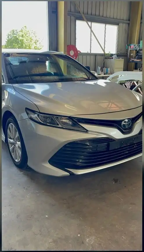 Silver Toyota Camry presented clean inside a Darwin workshop after detailing