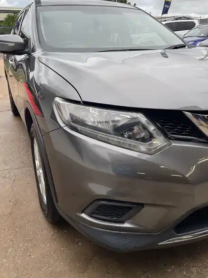 The same grey Nissan X-Trail with the front corner repaired, showing straight panel lines and a refinished bumper and grille